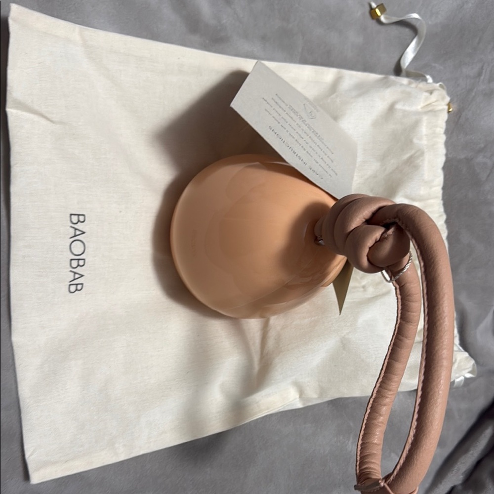 Baobab Collection Peach Nude Round Knot Wristlet Clutch